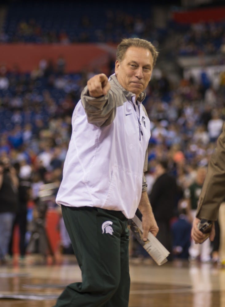 <p>Head coach Tom Izzo points to fans April 3, 2015, during the practice at NCAA tournament in the final four round at Lucas Oil Stadium in Indianapolis, Indiana. Spartans practice in preparation for their game against Duke University. Hannah Levy/The State News.</p>