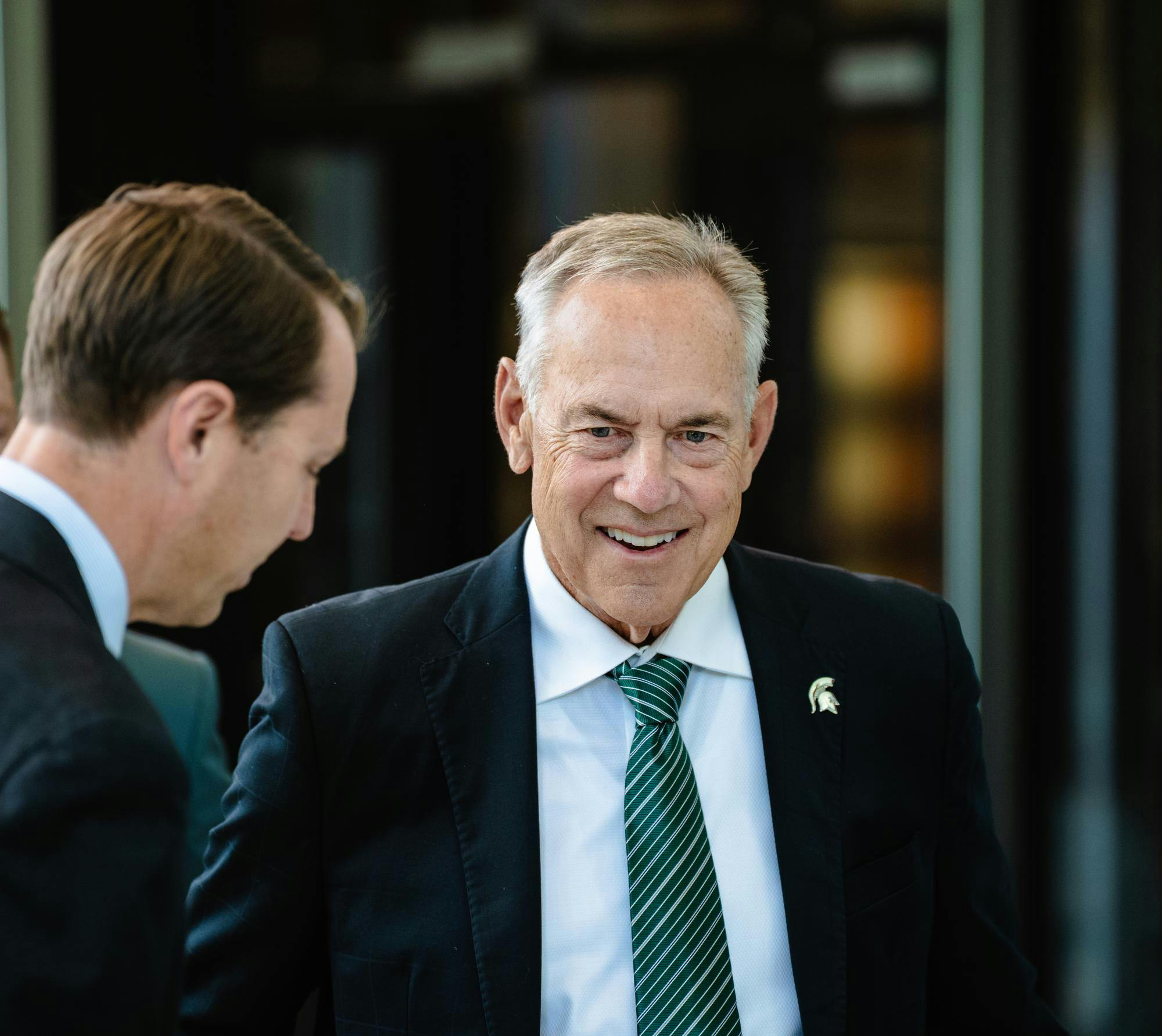 Mark Dantonio walks through the Michigan State Athletics Hall of Fame met by Athletic Director J Batt in East Lansing, Michigan on Sept. 12, 2025.