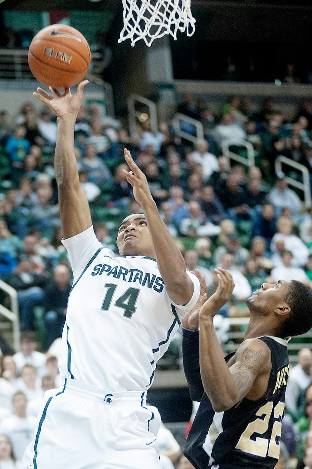 	<p>Freshman guard Gary Harris tries to put points on the board with Golden Lion forward Mitchell Anderson in defense. The Spartans lead Arkansas-Pine Bluff at the half, 38-12, Wednesday, Dec. 5, 2012, at Breslin Center. Justin Wan/The State News</p>