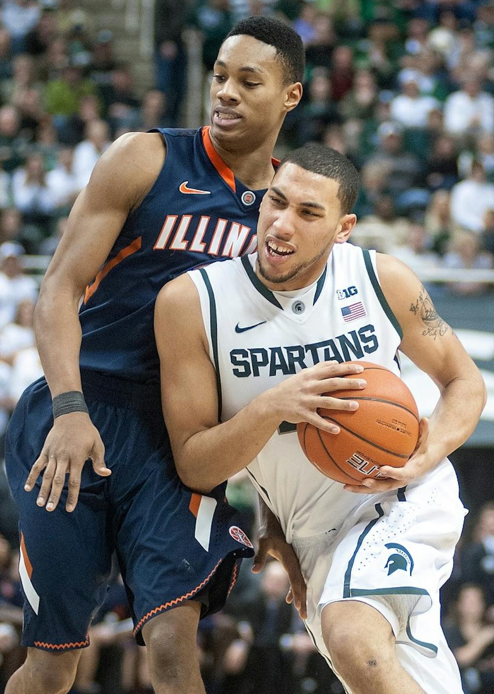 	<p>Freshman guard Denzel Valentine tries to get past Illinois guard Joseph Bertrand. The Spartans defeated the Fighting Illini,, 80-75, Thursday, Jan. 31, 2013, at Breslin Center. Justin Wan/The State News</p>