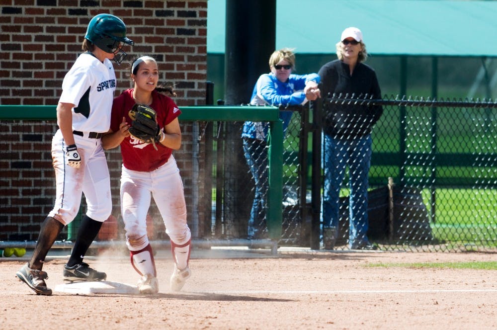 	<p>Senior outfielder Karen Fox holds her ground at third base as Indiana infielder Shelby Gogreve tags her base with the ball Saturday afternoon at Secchia Stadium. The Spartans lost the game to Indiana, 7-2. Matt Hallowell/The State News</p>