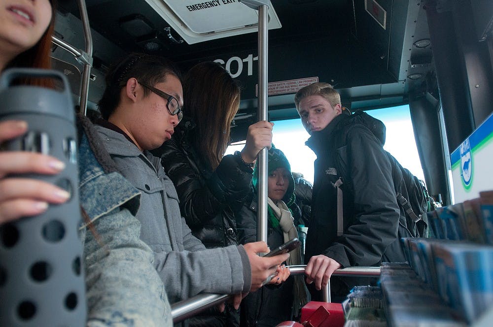 <p>Students ride the Route 31 CATA bus Jan. 20, 2015, toward Brody Neighborhood. Allyson Telgenhof/The State News.</p>