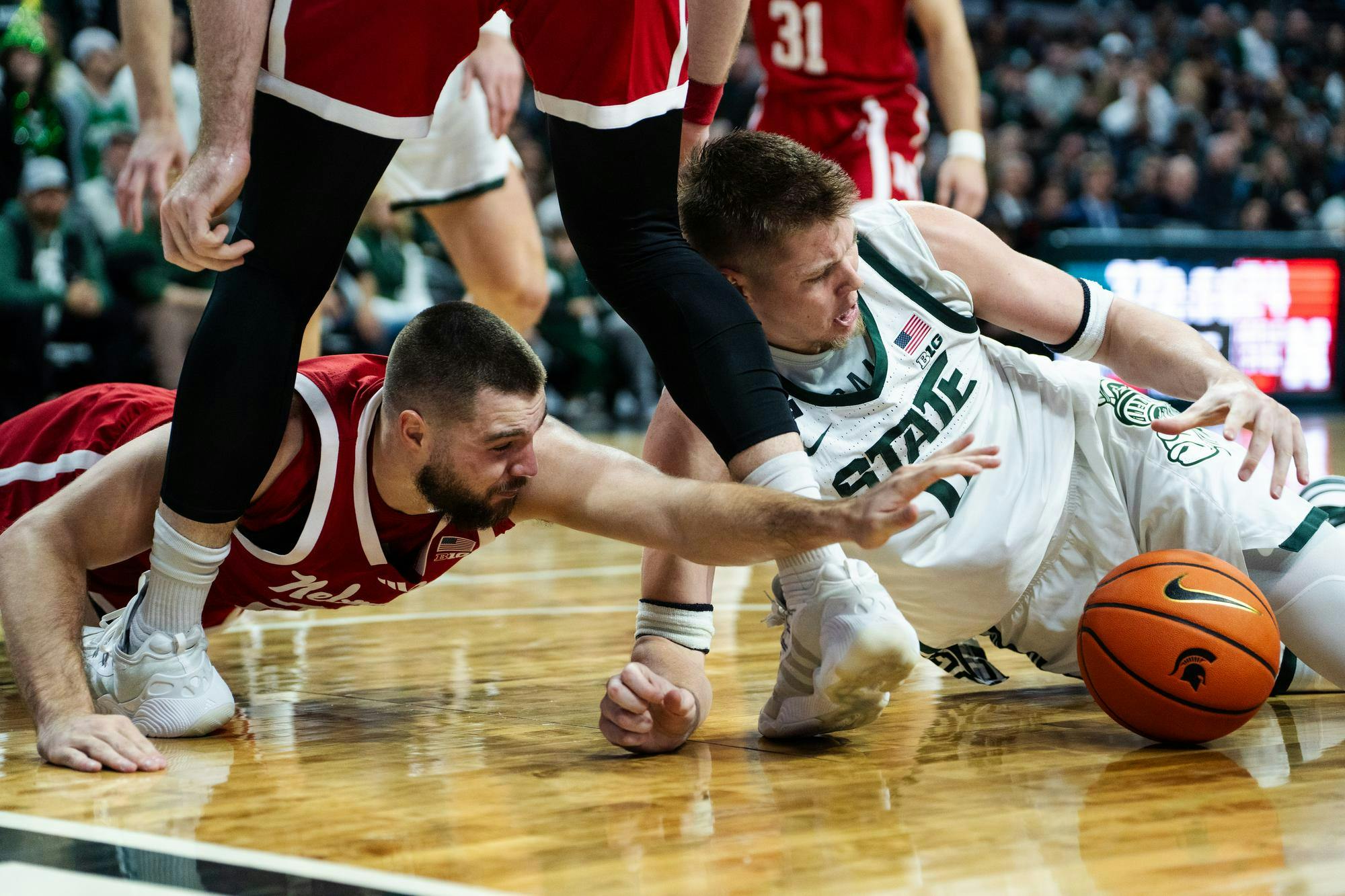 <p>Michigan State junior forward Jaxon Kohler (0) and University of Nebraska senior guard Rollie Worster (24) battle for the ball during their game held at the Breslin Center on Dec. 7, 2024.</p>