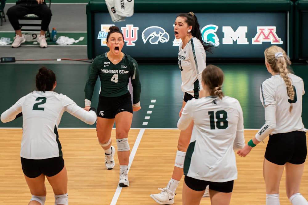 Michigan State volleyball celebrates after a point, during the Spartans' loss to Ohio State on Jan. 31, 2021.