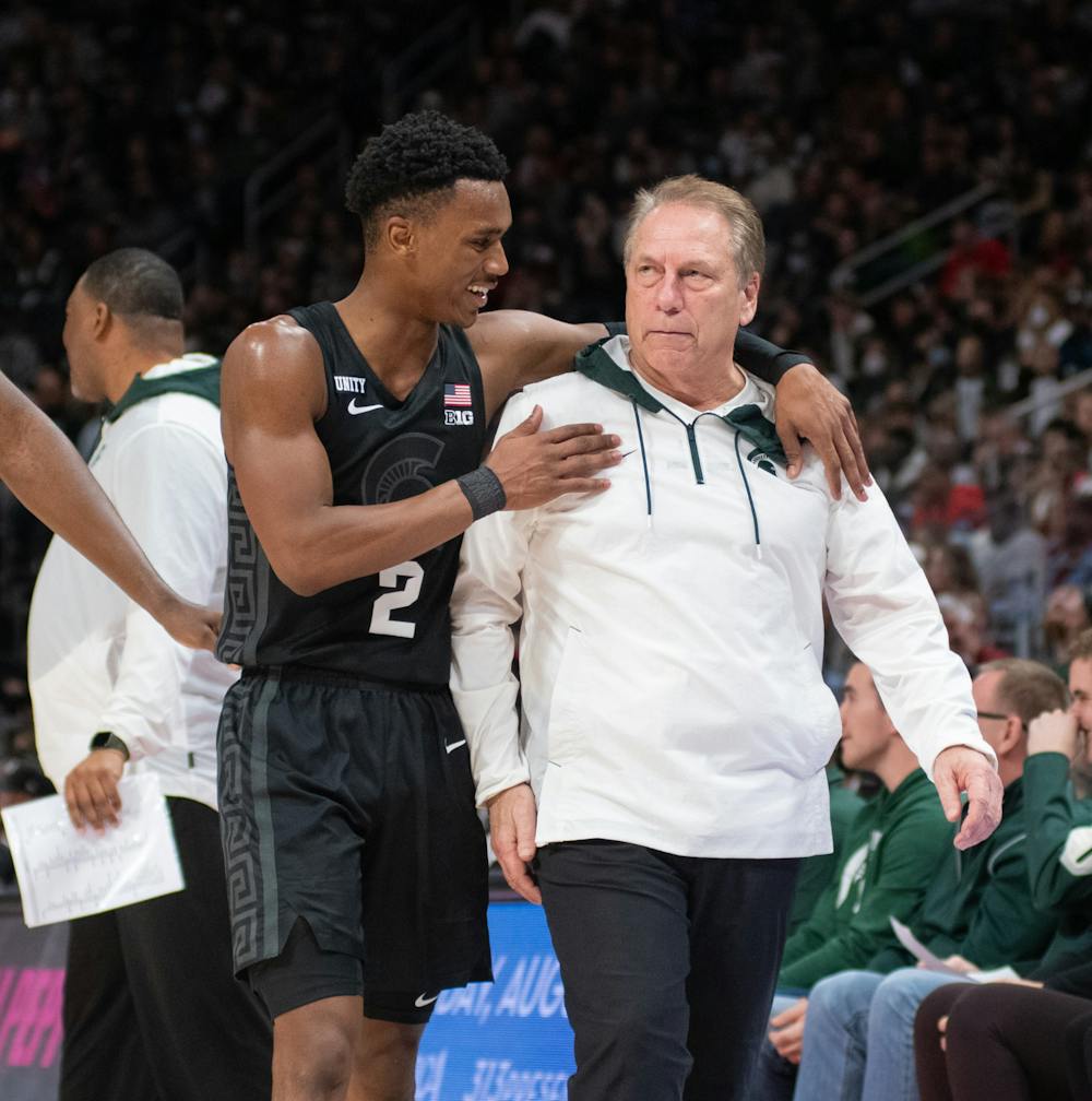 <p>Walker (2) brings Coach Tom Izzo back to the sideline and away from the officials to prevent him from being ejected from the game in the Spartans&#x27; game against the Oakland Golden Grizzlies at Little Caesars Arena on Tuesday, Dec. 21, 2021. </p><p> </p>