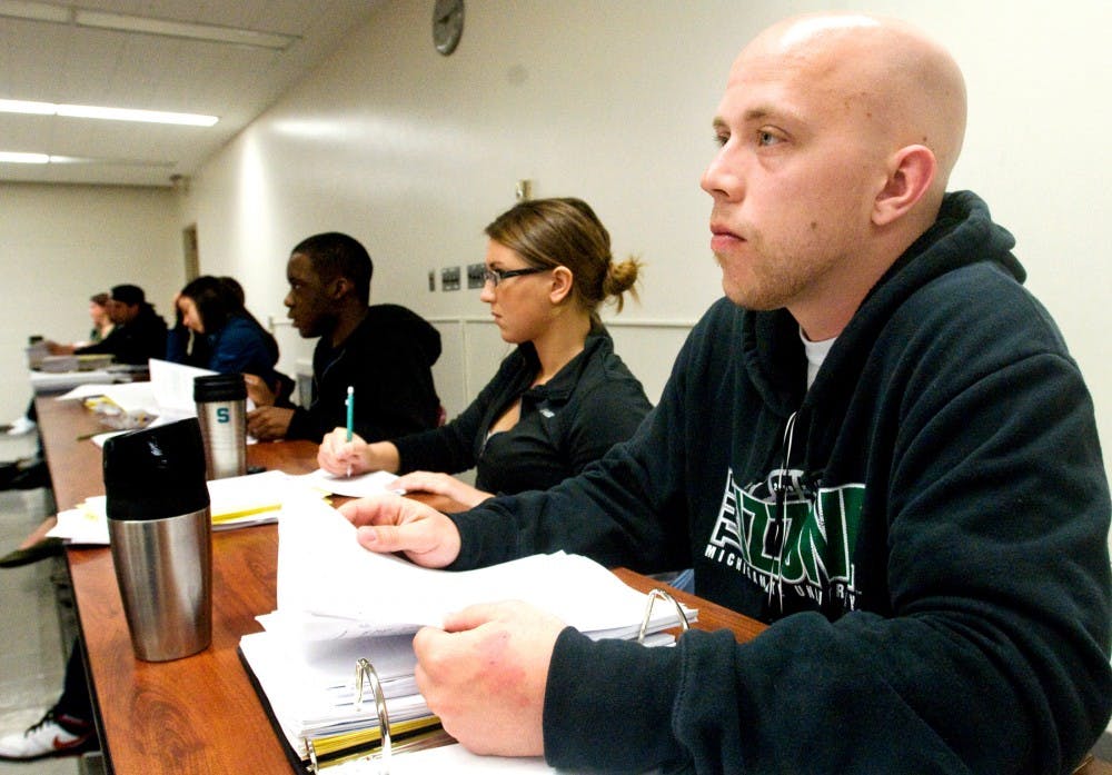 Acounting senior Mike DeBona in his environmental taxation class Monday morning at Epply Center. The accounting program here at MSU is being ranked No. 2 in the nation by AccountingCareersForDummies.com for strength of job opportunities and high academic standards. Derek Berggren/The State News