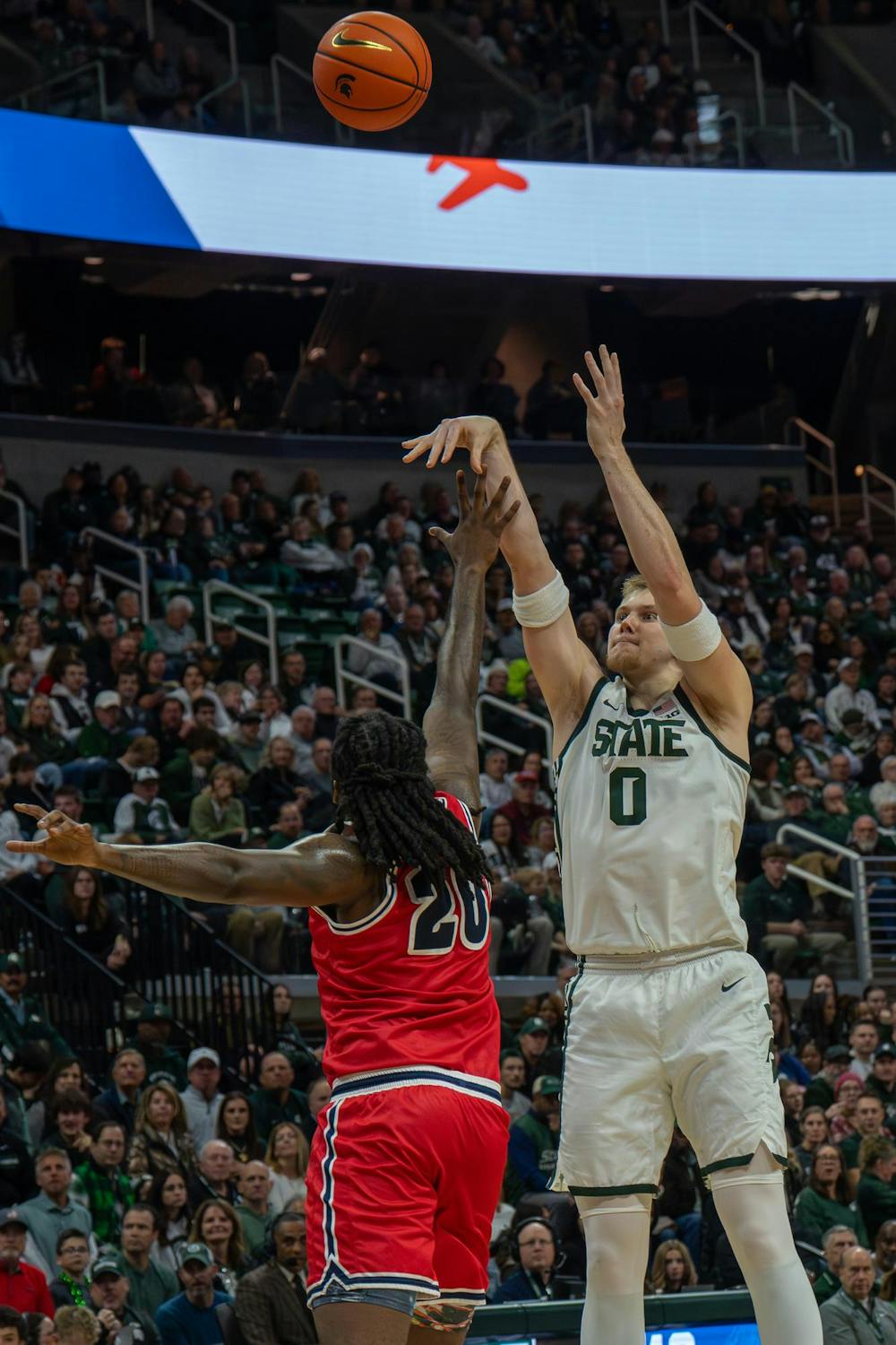 Michigan State forward Jaxon Kohler (0) goes up for a shot as Detroit Mercy forward London Maiden (20) attempts to block it at the Breslin Center in East Lansing, Mich., on Friday, Nov. 21, 2025.