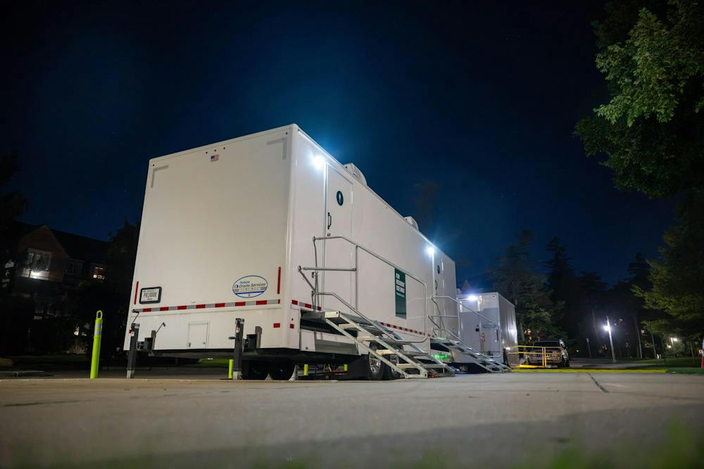 <p>Mobile shower units are brought on campus following a campuswide power outage at Michigan State University on Delta Ct in East Lansing, Mich., on Wednesday, Sept. 23, 2026. MSU announced mobile showers would be available for students in West Circle as hot water and steam restoration continues across campus.</p>