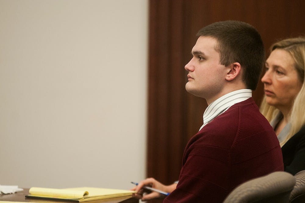 	<p>Connor McCowan watches his former high school athletic trainer testify during his trial as a character witness Monday at Ingham County Circuit Court in Lansing. McCowan was found guilty of second-degree murder Tuesday. Danyelle Morrow/The State News</p>