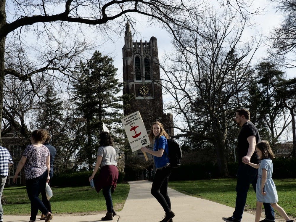 Members and supporters of the MSU Graduate Employees Union protest for more reliable negations on salary, housing, healthcare, and childcare across MSU on April 22, 2019. The protest ended with a camp out in front of the Hannah Administration Building.