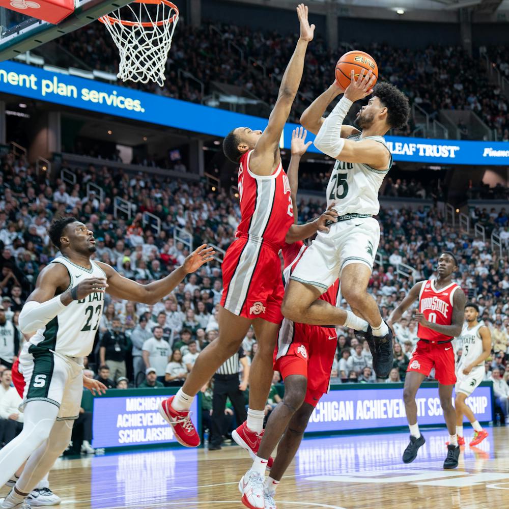 <p>Graduate Student forward Malik Hall (25) attempting a contested layup during a game against Ohio State University at the Breslin Student Event Center on Feb. 25, 2024.</p>