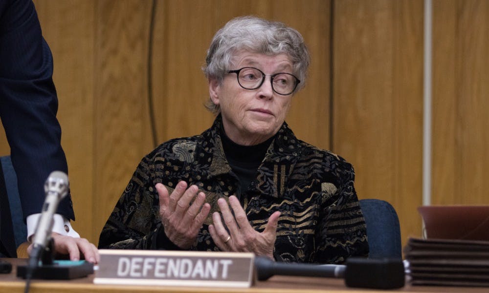 Former Michigan State President Lou Anna K. Simon shrugs about scheduling during her arraignment at the Eaton County Courthouse on Nov. 26, 2018. She is being charged with four counts of lying to a Peace Officer about the Nassar Investigation.