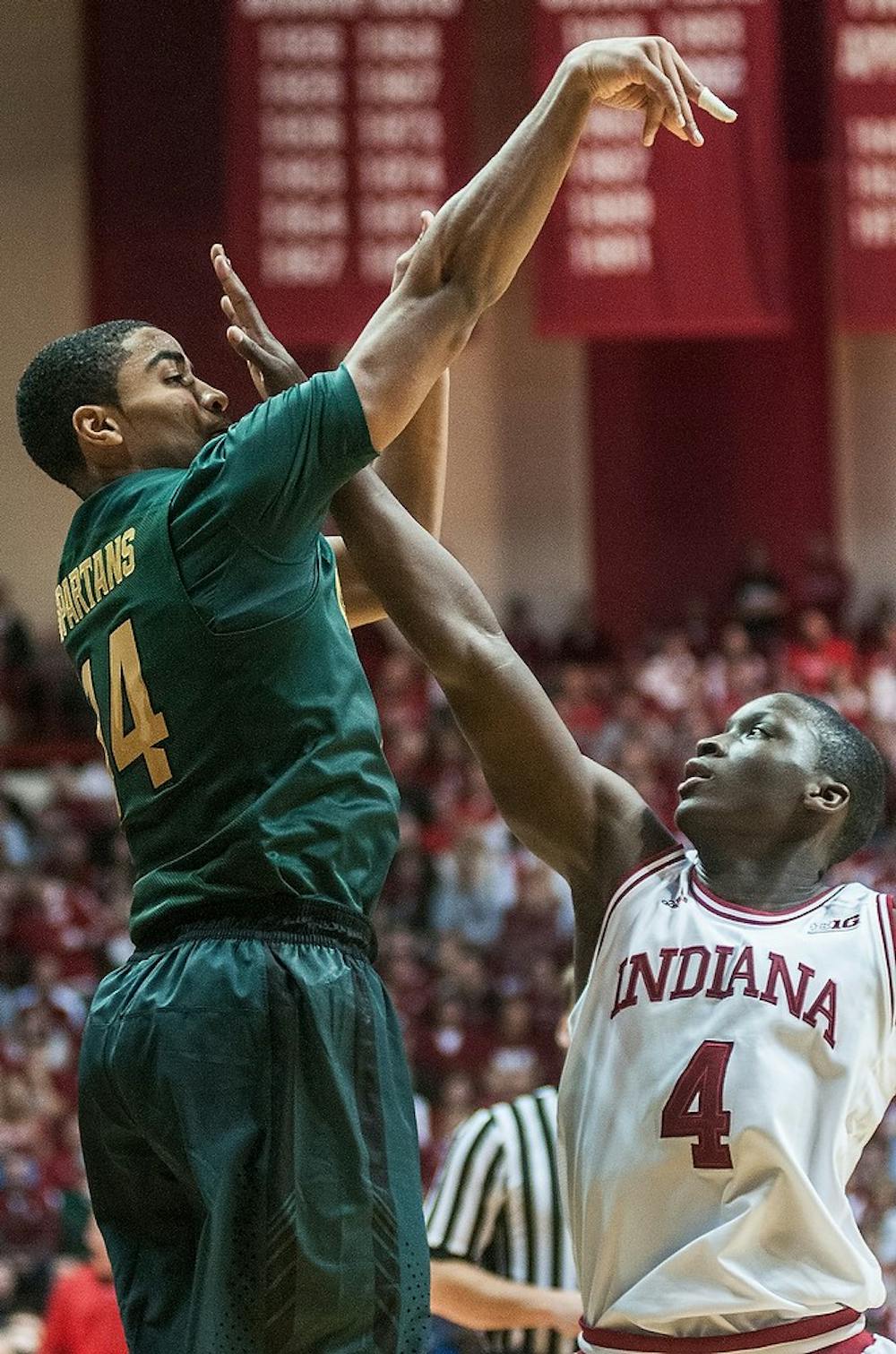 	<p>Freshman guard Gary Harris makes a three-pointer as Indiana guard Victor Oladipo puts a hand in his face Sunday, Jan. 27, 2013, at Assembly Hall in Bloomington, Ind. Harris recorded 21 points during the Spartan&#8217;s, 75-70, loss to the Hoosiers. Adam Toolin/The State News</p>