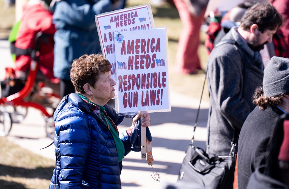 <p>A protestor holds a sign saying "America needs responsible gun laws" at the Gabby Giffords gun rally at the Michigan State Capitol on March 15, 2023. </p>