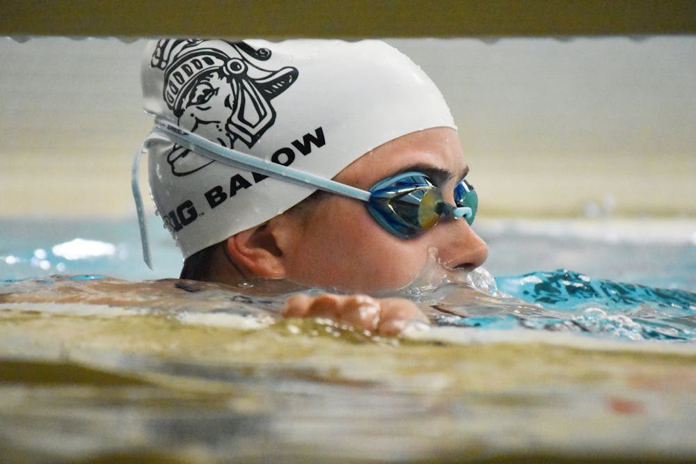 <p>Junior freestyler Sophia Balow focuses-in during a practice at IM West on March 16, 2022. Balow is a plaintiff in the Title IX lawsuit and has spoken in front of the Board of Trustees in an attempt to bring the swim team back. </p>