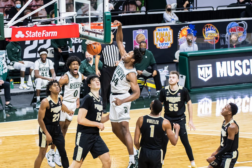 <p>Sophomore forward Julius Marble II (34) dunks over Purdue defenders during the Spartans&#x27; 55-54 loss to Purdue on Jan. 8, 2021.</p>