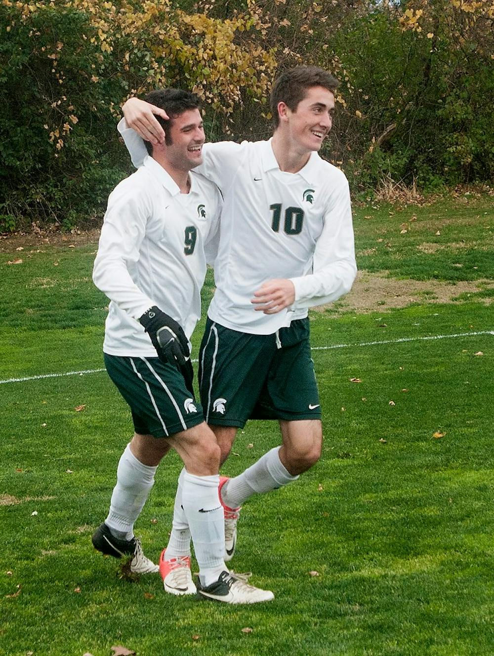 Freshman midfielders Sean Conerty, left, and Jay Chapman embrace after Chapman's second goal of the game Oct. 28, 2012, at DeMartin Stadium at Old College Field. Chapman recorded his first three collegiate goals during the game, leading the Spartans to a 3-1 victory over the Hoosiers. Natalie Kolb/The State News