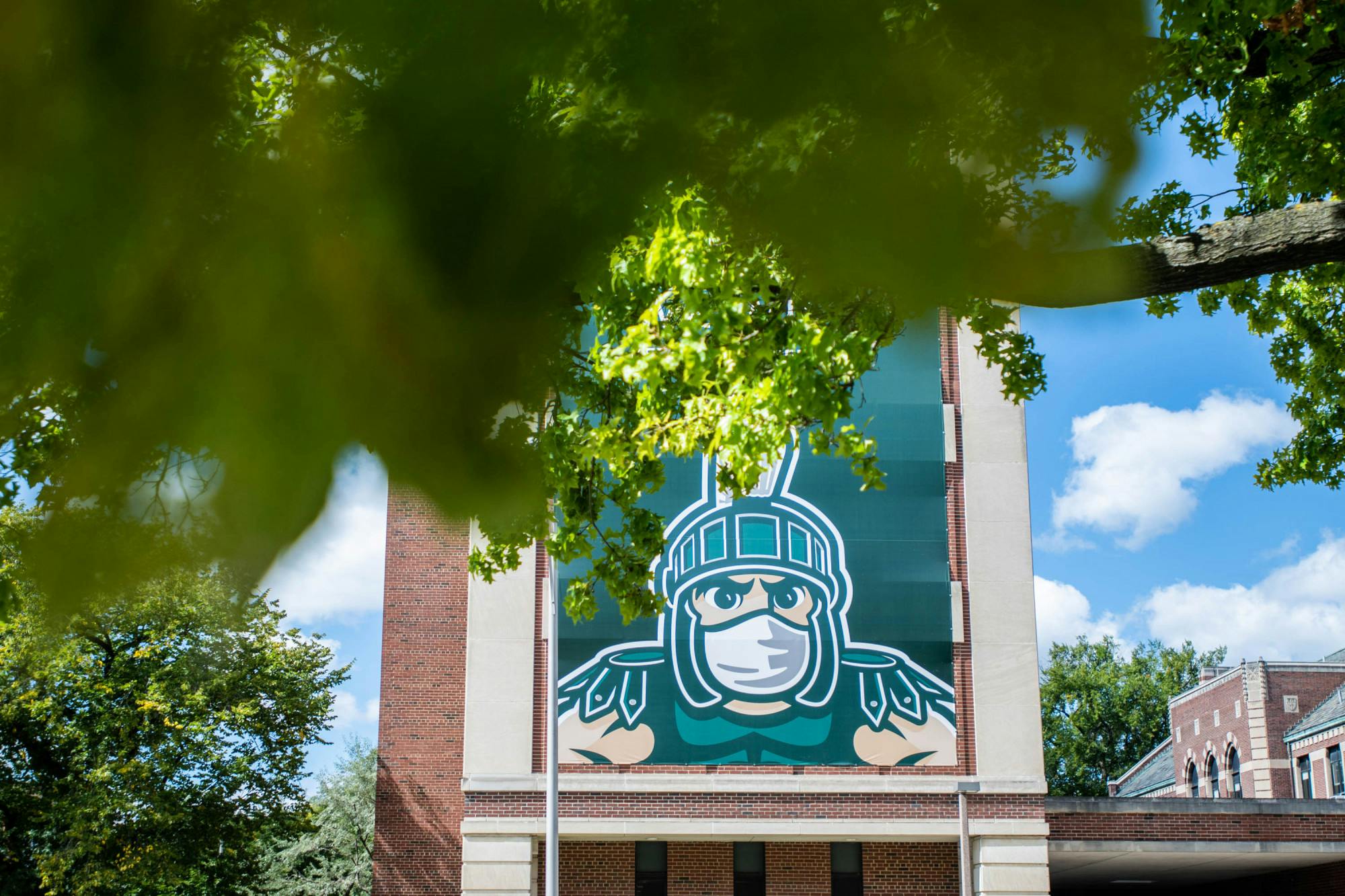 <p>Campus on Sept. 18, 2020. MSU has put up large posters around campus to encourage students and the community to practice social distancing and to wear masks.</p>