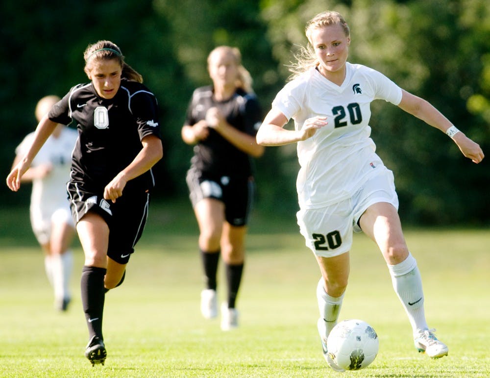 	<p>From right, <span class="caps">MSU</span> Junior forward Olivia Stander completes for procession with Oakland midfielder Nicole DeLuca. Stander shoots the single goal of the game and helps <span class="caps">MSU</span> to advance over Oakland for 1-0 at DeMartin Stadium at Old College Field Thursday evening. Justin Wan/The State News</p>