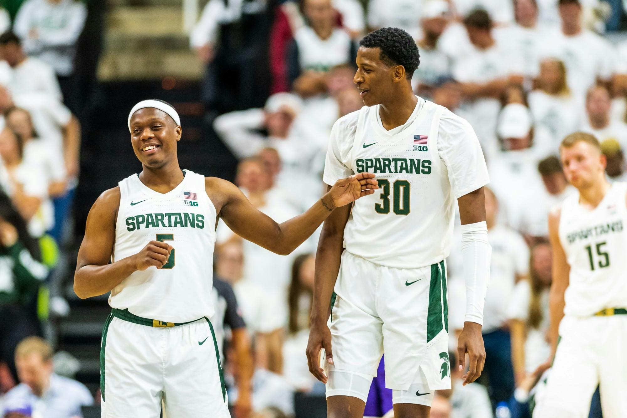 <p>Senior guard Cassius Winston (left) and sophomore forward Marcus Bingham Jr. (right) talk after a timeout. The Spartans defeated the Britons, 85-50, at half on Oct. 29, 2019 at the Breslin Student Events Center. </p>