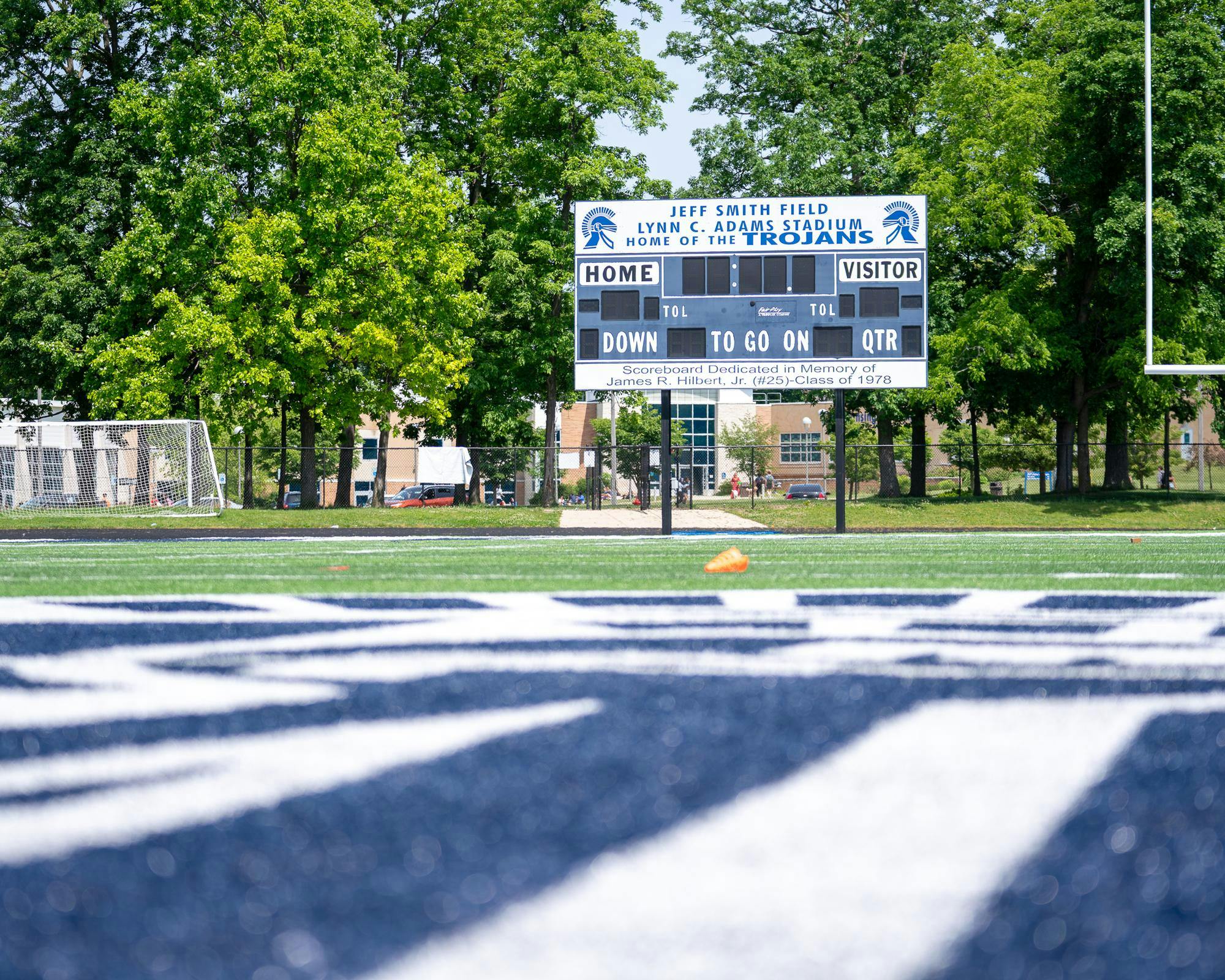 The scoreboard on the football field at East Lansing High School on May 24, 2024.