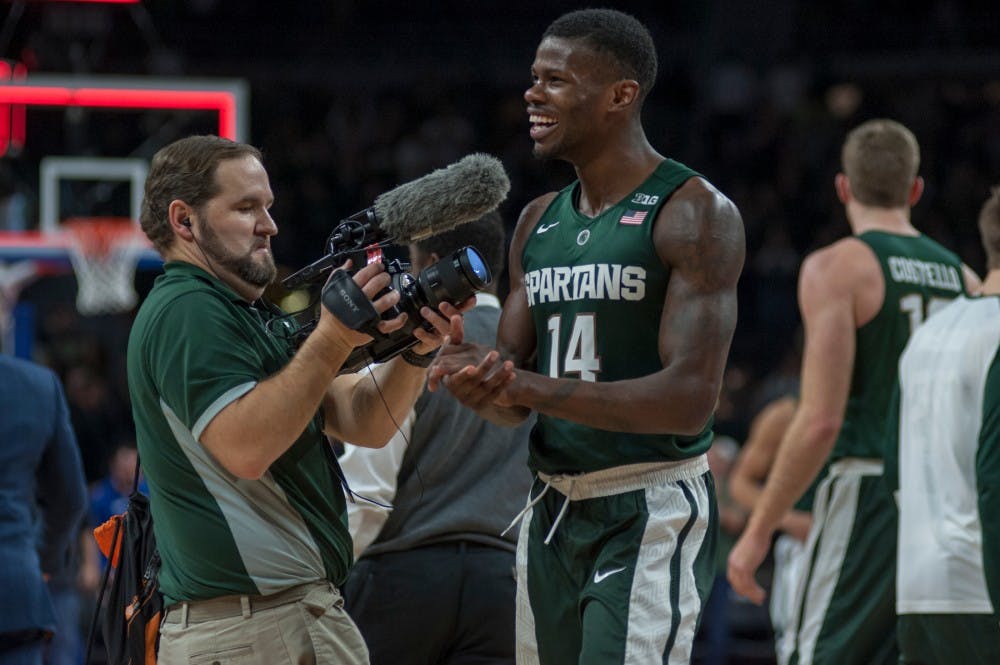 Junior Forward Eron Harris celebrates on Dec. 22, 2015 during the game against Oakland University at the Palace of Auburn Hillin Auburn Hills, Mich. The Spartans defeated the Grizzlies, 99-93 in overtime.