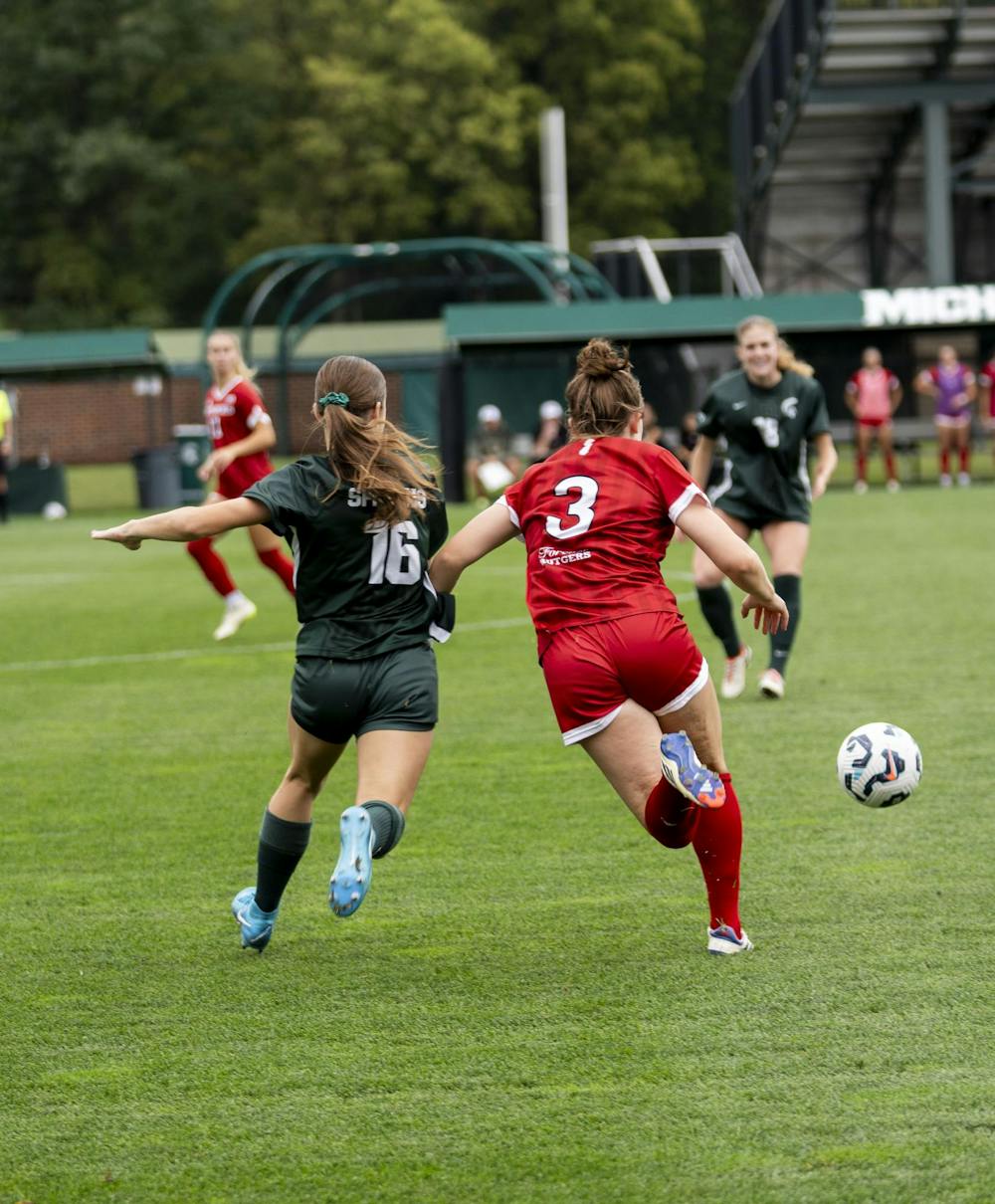 <p>MSU Freshman midfielder Kaleigh McPherson (16) runs to take the ball before Rutgers freshman midfielder Shaela Bradley (3) at the MSU versus Rutgers game on Sept. 29, 2024.</p>