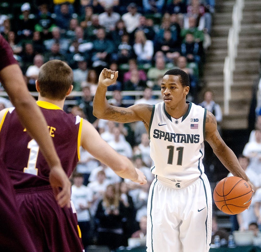 	<p>Junior guard Keith Appling signals a play to the rest of his team on Saturday, Dec. 8, 2012 at the game against Loyola-Chicago at The Breslin Center. Appling scored a total of eight points throughout the game. Katie Stiefel/ State News</p>