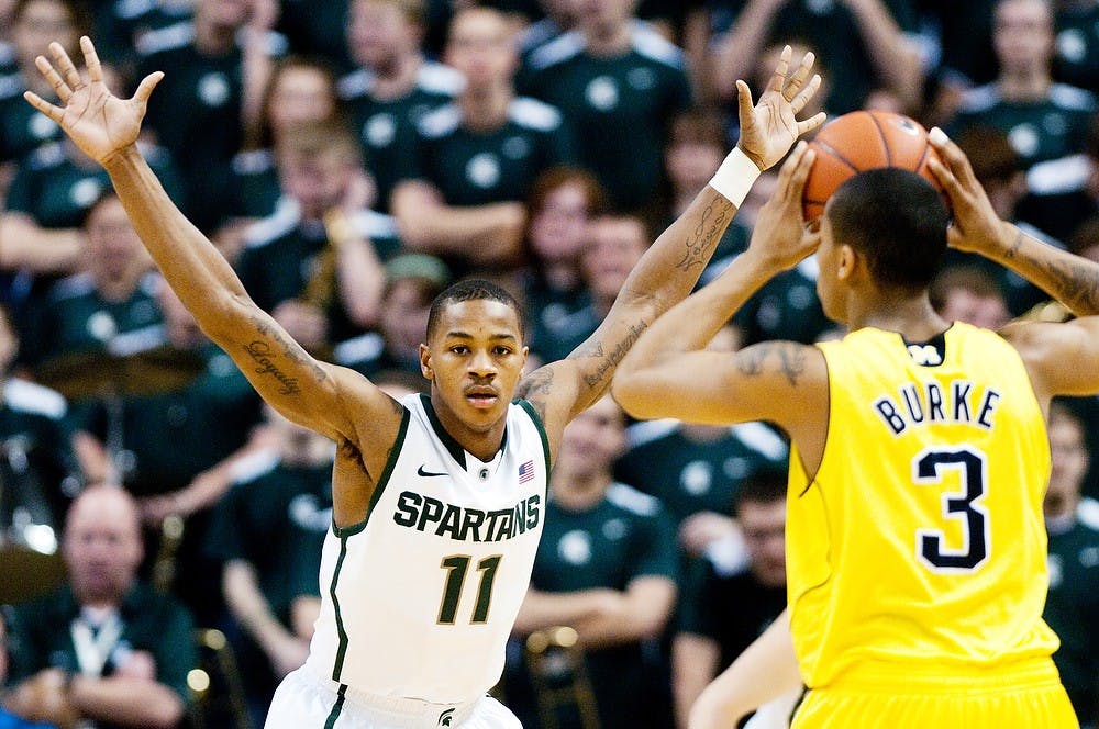 	<p>Sophomore guard Keith Appling defends the Spartan basket from Michigan guard Trey Burke on Feb. 6, 2012 at Breslin Center. Appling added 10 points to the Spartans total in the 64-54 victory over Michigan. Matt Hallowell/The State News</p>