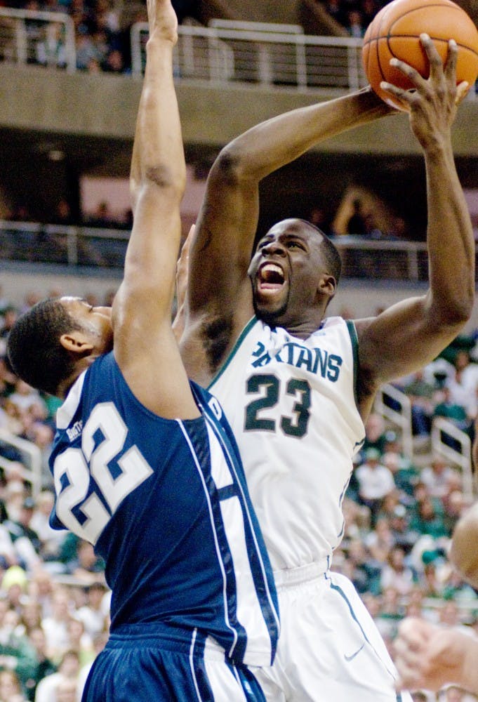 Junior forward Draymond Green goes up for a shot over Penn State forward Andrew Jones Thursday at  Breslin Center. Green's 15 points, 14 rebounds and 10 assists led the Spartans to a 75-57 victory over the Nittany Lions. He is only the third Spartan to record a triple-double in team history. Matt Radick/The State News