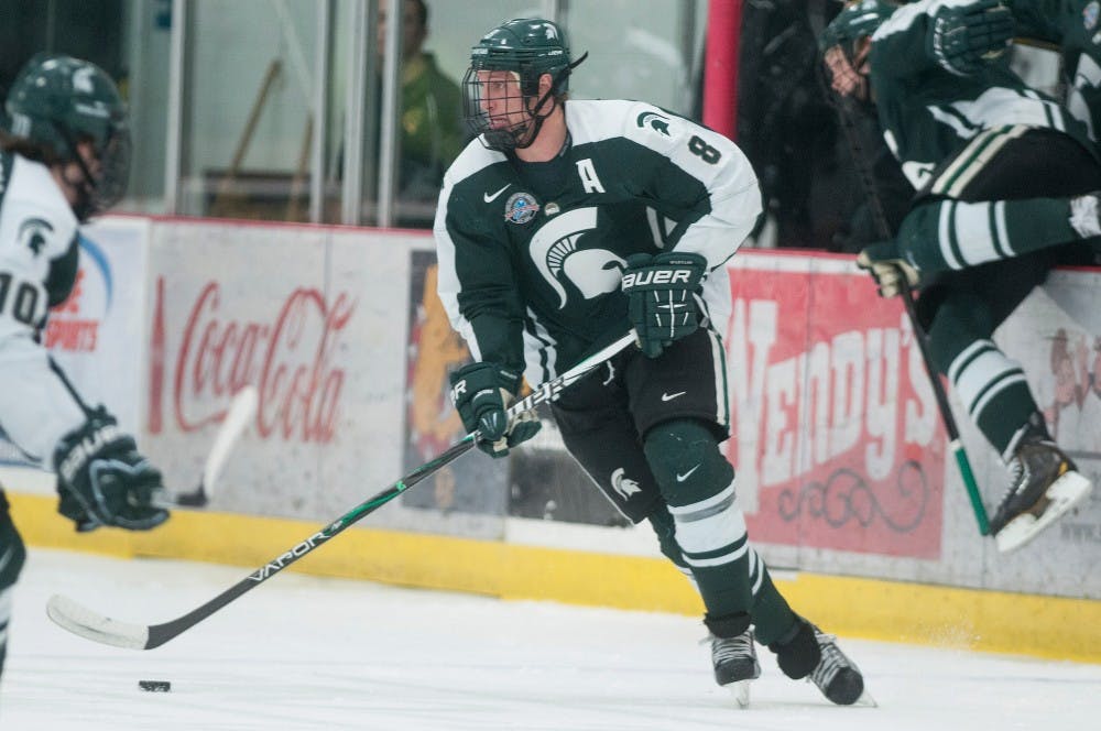 	<p>Senior forward Chris Forfar pushes the puck down the ice Jan. 5, 2013 at the Ewigleben Ice Arena in Big Rapids, Mich. The Bulldogs beat the Spartans 3-0. Julia Nagy/The State News</p>