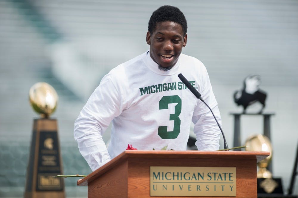 Teammate Darqueze Dennard gives a speech during the celebration of life for former Michigan State punter Michael R. Sadler on July 31, 2016 at Spartan Stadium. Sadler and Nebraska punter Samuel N. Foltz were killed in a car accident on their way home from a kicking camp in Merton, Wisc.