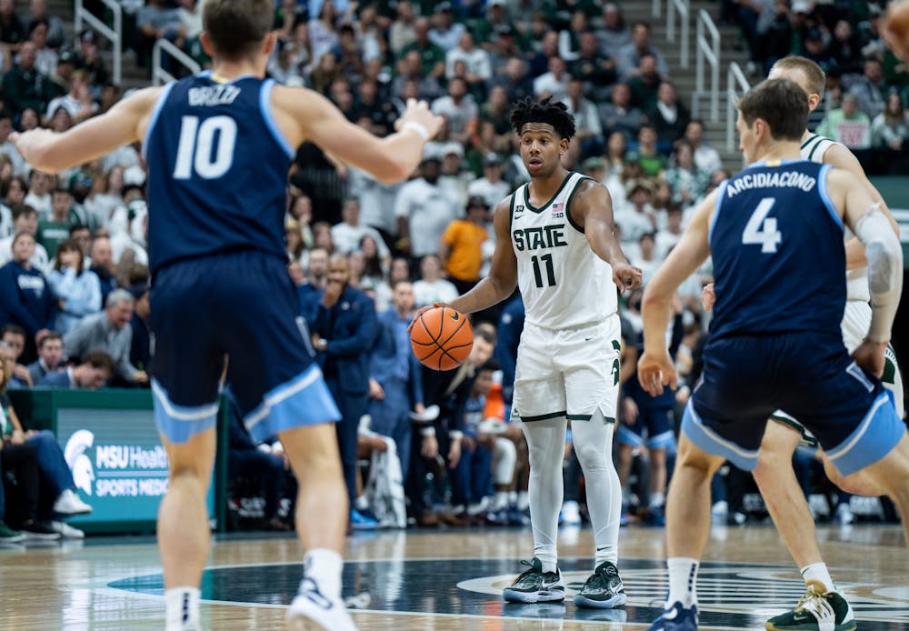 <p>Junior guard A.J. Hoggard (11) dribbles the ball during the game against Villanova at the Breslin Center on Nov. 18, 2022. The Spartans defeated the Wildcats 73-71. </p>