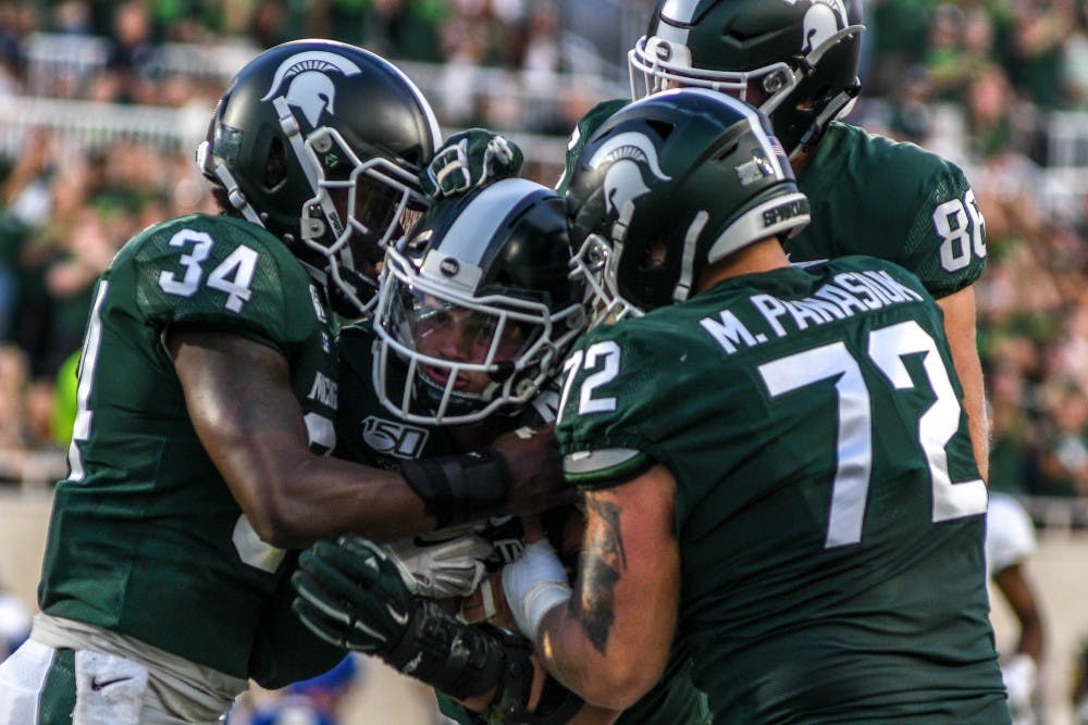 The Spartans celebrate during the game against Tulsa on Aug. 30, 2019 at Spartan Stadium. The Spartans defeated the Golden Hurricane, 28-7.