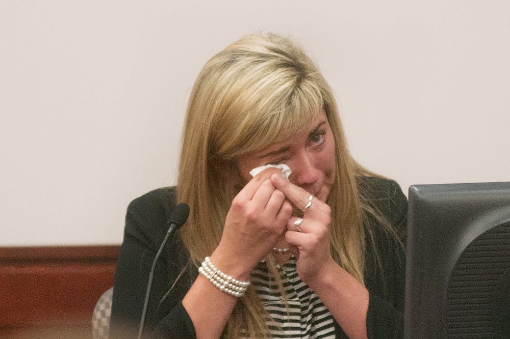 	<p>Shay McCowan, sister of alleged killer Connor McCowan, wipes her tears during her testimony Monday at Ingham County Circuit Court in Lansing. Connor McCowan has been charged with the murder of Shay McCowan&#8217;s former boyfriend and <span class="caps">MSU</span> student, Andrew Singler. Georgina De Moya/The State News</p>