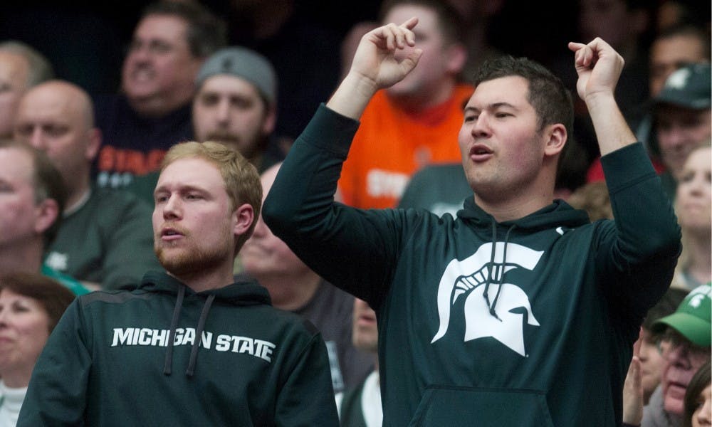 <p>Spartan fans cheer March 29, 2015, during the East Regional round of the NCAA Tournament in the Elite Eight against Louisville at the Carrier Dome in Syracuse, N.Y. The Spartans defeated the Cardinals, 76-70. Erin Hampton/The State News</p>