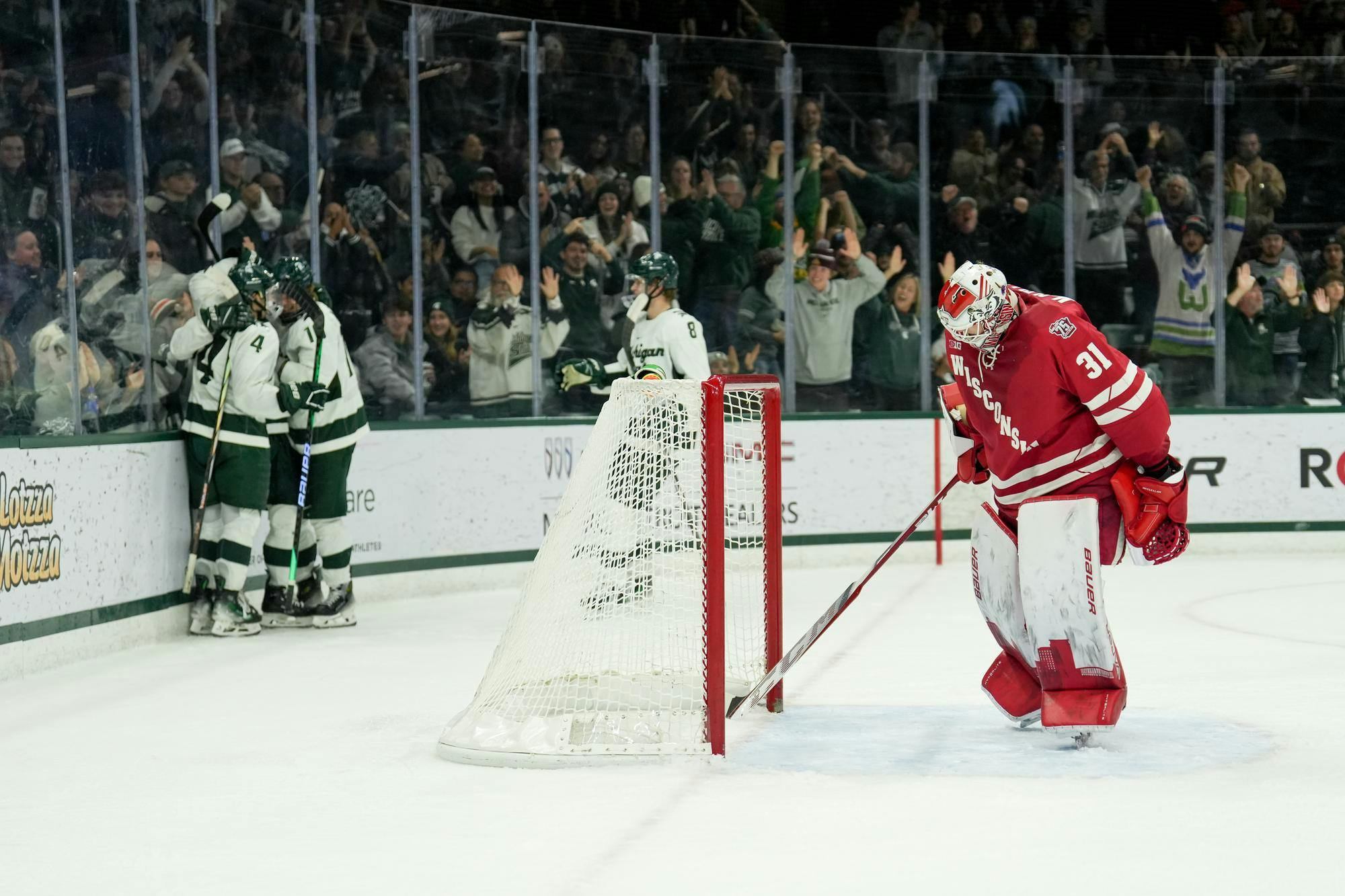 <p>The Michigan State Spartans celebrate a goal scored by Tanner Kelly (26) against the Wisconsin Badgers at Munn Ice Arena on Nov. 17, 2023.</p>