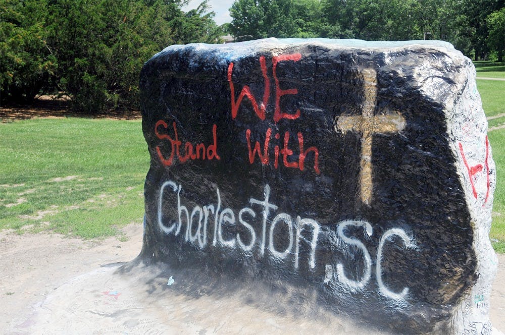 <p>The rock on Farm Lane was painted by BSA members June 18 to show support for the Charleston, S.C., shooting victims and the community. Joshua Abraham/The State News</p>