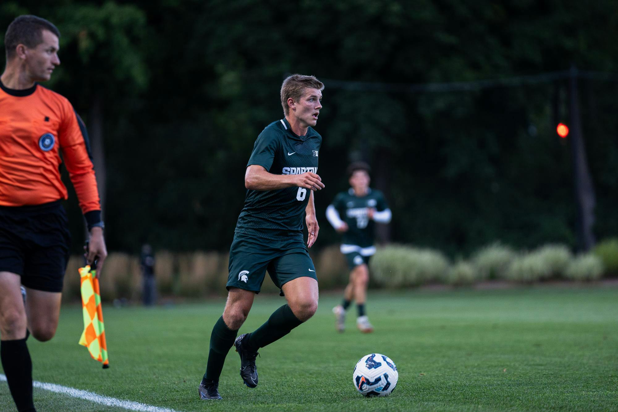 <p>Michigan State junior midfielder Jonathan Stout (6) scans the field of play during a match against Air Force in East Lansing on Sept. 6, 2024. The Spartans scored, and conceded shortly after in the second half, finishing with a score of 1-1</p>