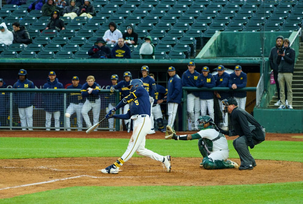 <p>Michigan graduate student center fielder Joe Stewart (5) reaches first during a fielder&#x27;s choice with the pitcher. Michigan State lost 18-6 to Michigan on April 15, 2022 at the Lugnut Stadium.</p>