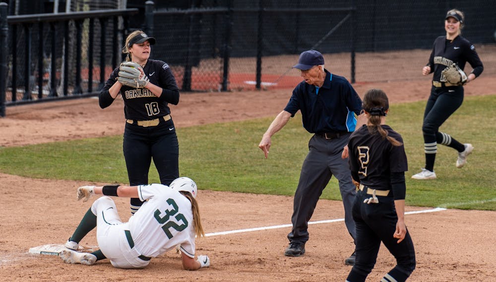 <p>An umpire calls sophomore third baseman Alexis Barroso (32) safe after a slide in the fifth inning. The Spartans fell to the Golden Grizzlies, 10-5, on April 5, 2022. </p>