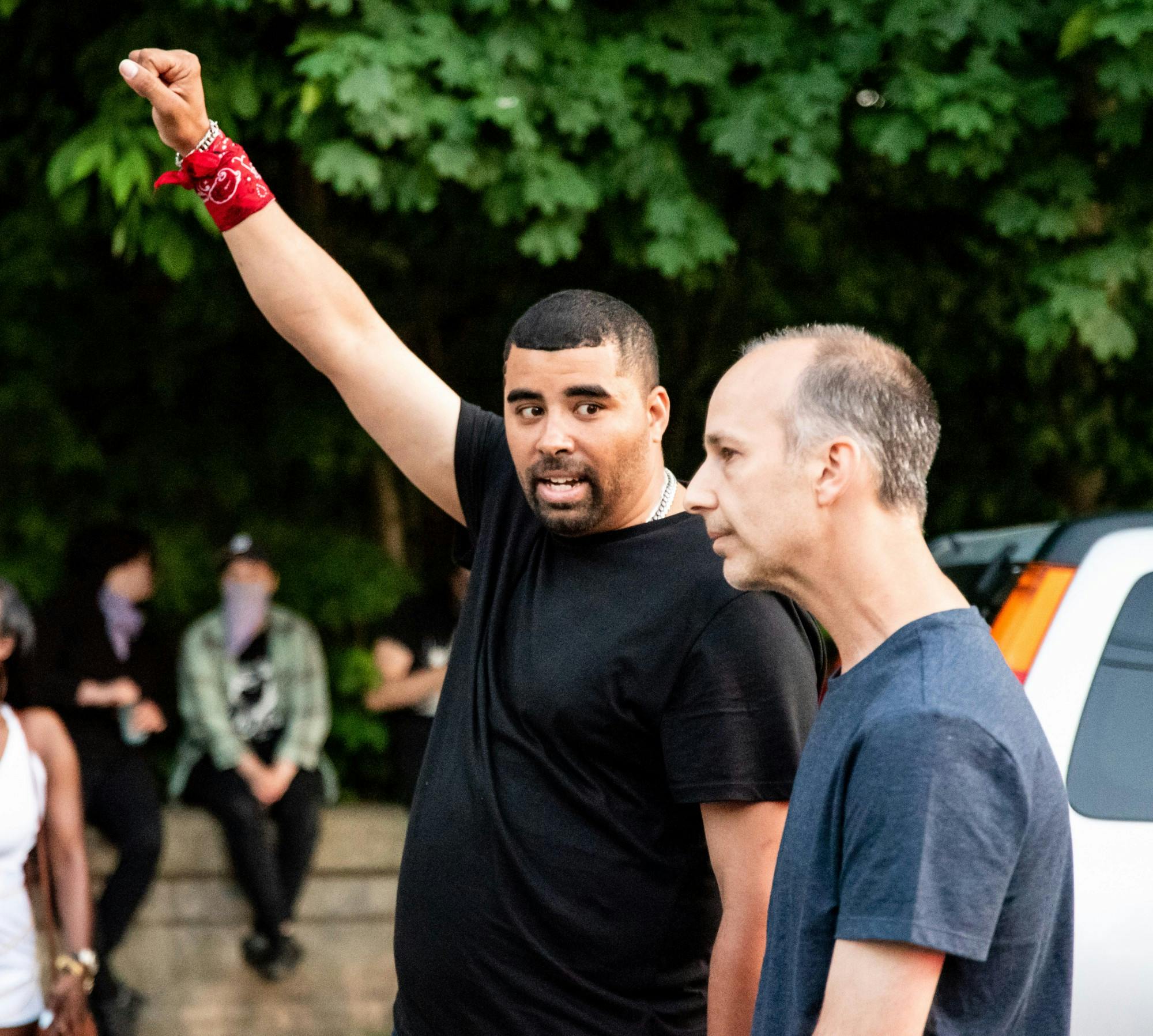 <p>Paul Birdsong speaks with Lansing Mayor Andy Schor outside Schor&#x27;s house after Birdsong led a group of protesters on a two-mile march from the Capitol to the mayor&#x27;s house June 6, 2020. Schor was not home when the group arrived.</p>