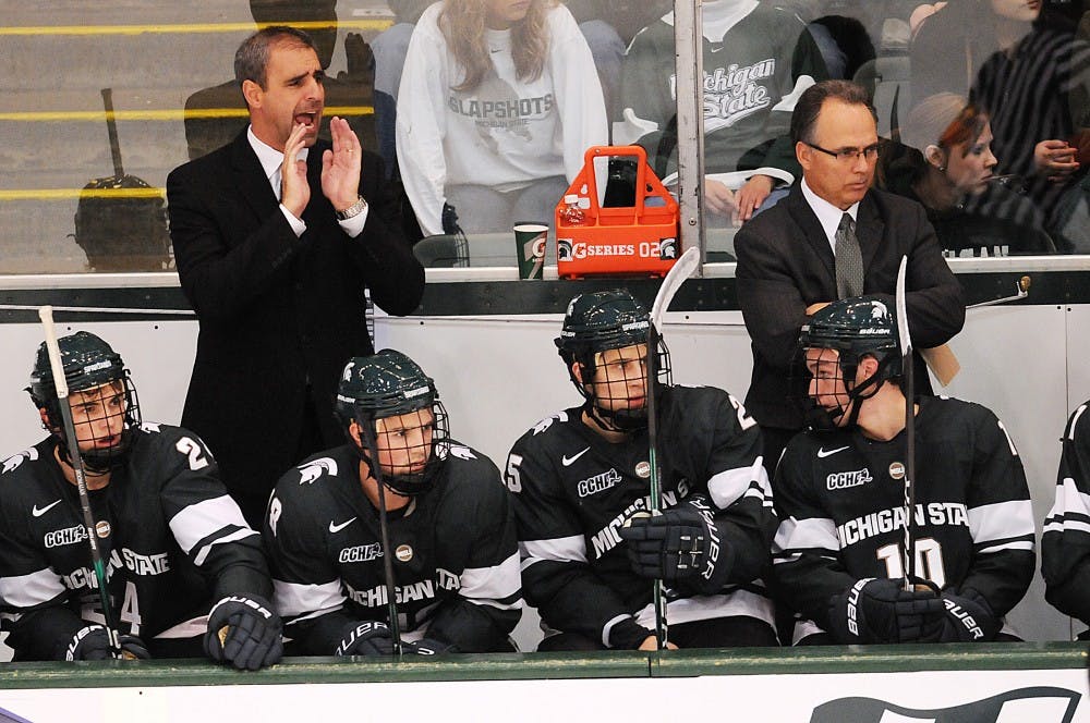 Head coach Tom Anastos shouts out to his team in the final minutes of the third period just as the Spartans secure their victory. The Spartans defeated Western Ontario, 6-1, on Monday night at Munn Ice Arena. The game was Tom Anastos' first time leading the Spartans on the ice after former head coach Rick Comley resigned after last season. Josh Radtke/The State News