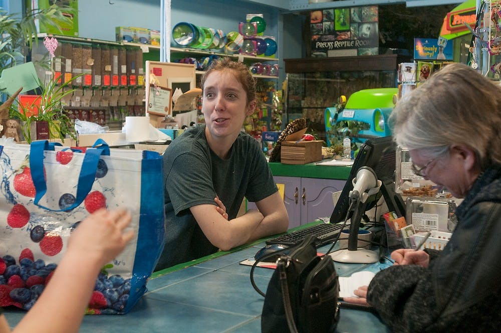 <p>Zoology senior Tori Baxter talks to Perry resident Mary Welsh Feb. 28, 2015, at Preuss Pets, 1127 N. Cedar St. in Lansing. Welsh said she has 205 guinea pigs at her house. Kelsey Feldpausch/ The State News</p>
