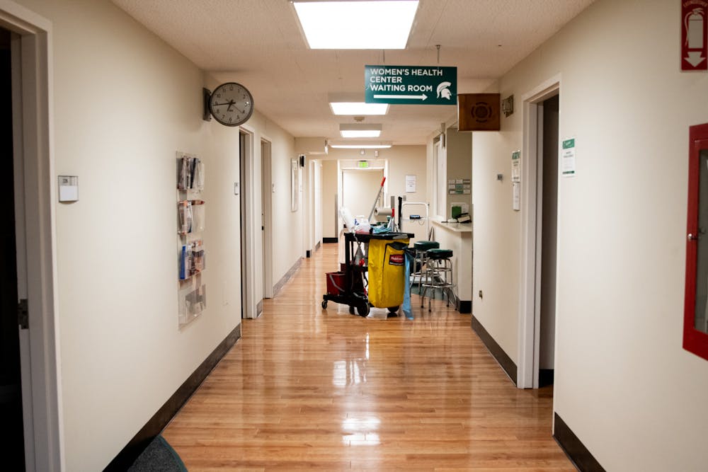 A janitor's cart sits alone on the second floor of Olin Health Center on Feb. 3, 2021. The cart belongs to IPF worker Skylar Ward, who has worked the third shift at Olin since the pandemic.