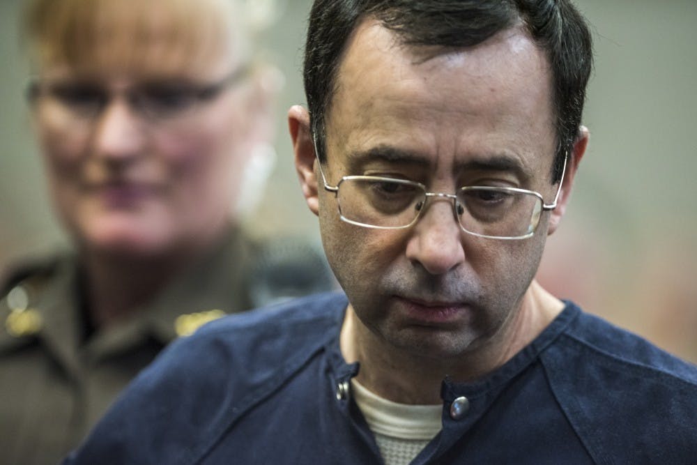 <p>Ex-MSU and USA Gymnastics Dr. Larry Nassar makes his appearance on the fifth day of his sentencing on Jan. 22, 2018 at the Ingham County Circuit Court in Lansing.&nbsp;</p>