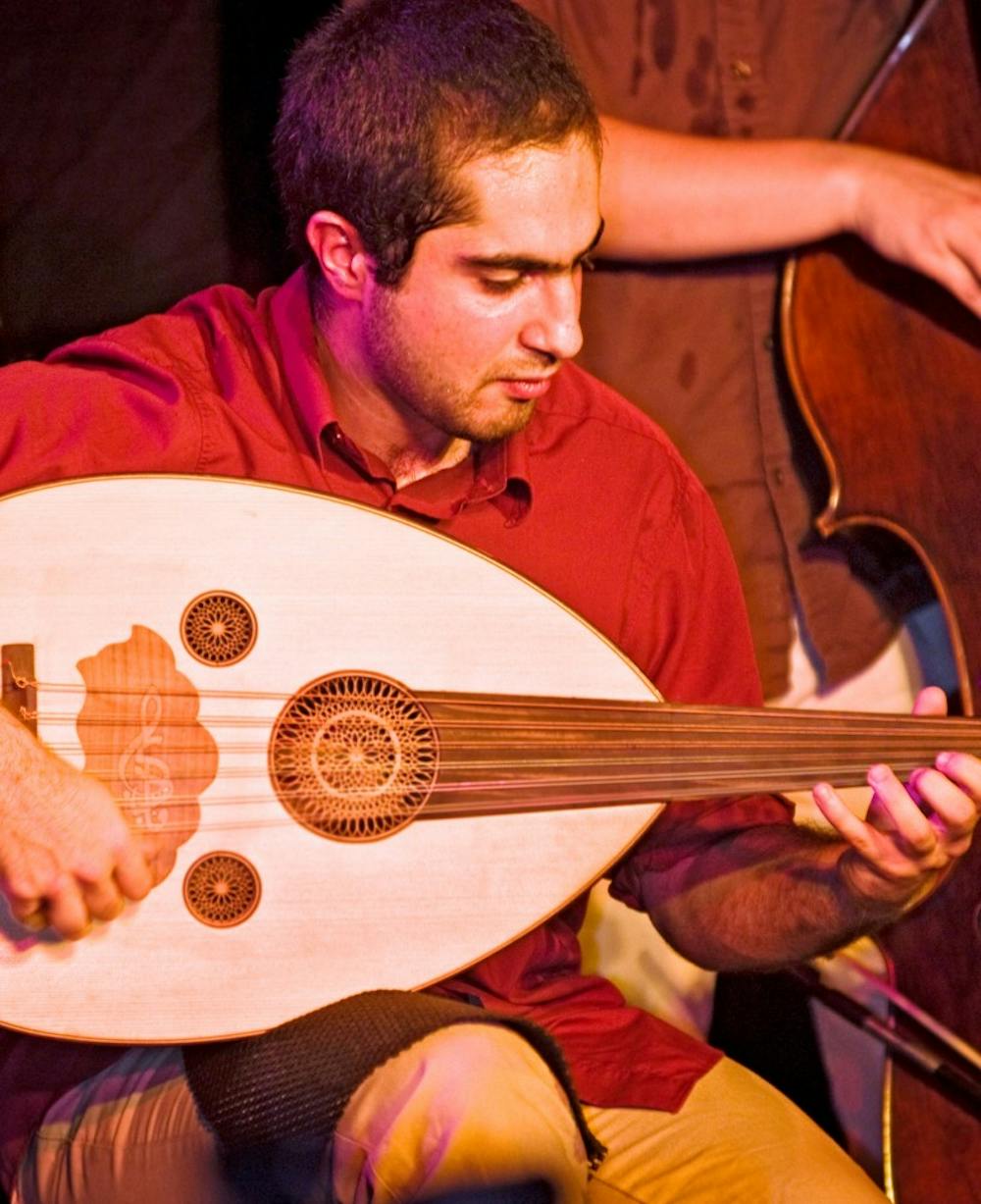 	<p>Igor Houwat of Wisaal, an East Lansing based Arabic fusion group, plays the oud while performing in (<span class="caps">SCENE</span>) Metrospace, 110 Charles Street, East Lansing.  The oud is an Arabic lute which, along with the percussion and bass instruments, contributes to the Middle Eastern tones of the group&#8217;s captivating repertoire.</p>