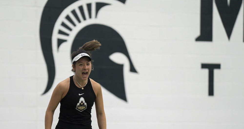 Purdue 5th year tennis player Csilla Fodor celebrates her wining during singles at the MSU Tennis Facility on Mar. 30, 24.