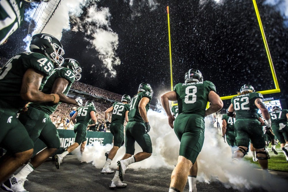 The MSU football team takes the field during the game against Notre Dame on Sept. 23, 2017 at Spartan Stadium. The Spartans fell to the Fighting Irish, 38-18. 