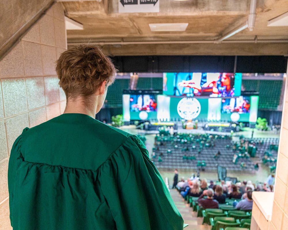 <p>A Michigan State future graduate looks down the stairs in the Breslin Center, awaiting his descent to join his peers at the convocation in East Lansing, Mich., on May 1, 2026.</p>